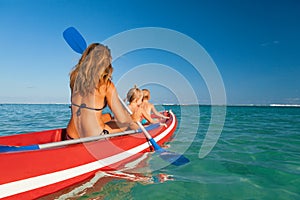 Happy family - young mother, children have fun on boat walk