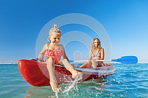 Happy family - young mother, children have fun on boat walk