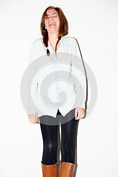 Happy, fashion and woman on a white background with funny joke, humor and comedy. Fashion, laughter and isolated person