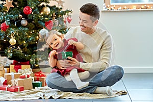 happy father and baby daughter on christmas