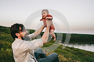 Happy father and baby outdoors family lifestyle dad and child