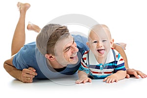 Happy father and baby son having fun pastime