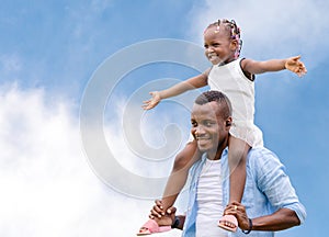 Happy father carrying daughter on shoulders, Cheerful african american girl on the shoulders of his father with clipping path