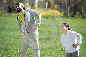 happy father and daughter doing physical exercise