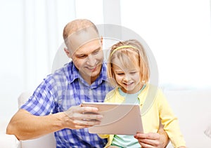 Happy father and daughter with tablet pc computer