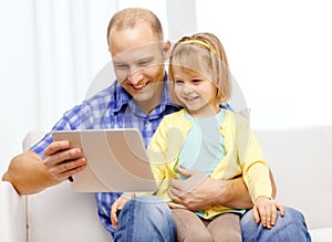 Happy father and daughter with tablet pc computer