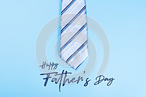 Happy Father Day background concept with blue necktie on blue background with copy space for text