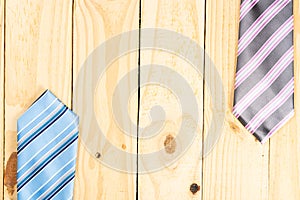 Happy Father Day background concept with blue and pink necktie on wooden background with copy space for text