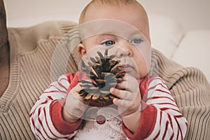 Happy father having fun with newborn baby son, family portrait