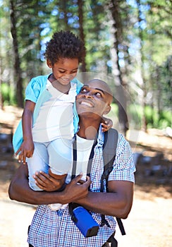 Happy father, hiking and carrying child in forest for family bonding, fresh air or exploring together in nature. Dad