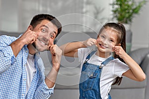 happy father and his cute little child daughter having fun
