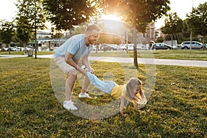 happy father and his daughter having fun outdoor