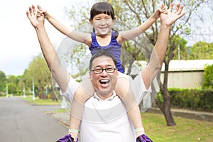 Happy Father and little girl with sunset