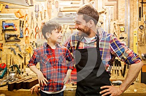 Happy father and little son workshop