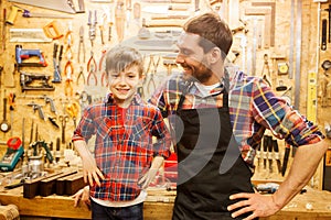 Happy father and little son workshop