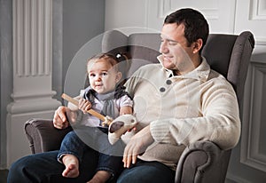 Happy father with one year old baby girl