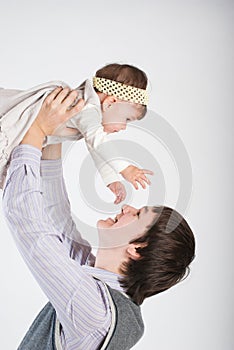The happy father plays with the daughter