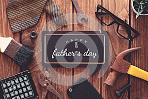 Happy father`s day background concept. Flat lay of construction  handy tools and  gentleman`s accessories over wooden background