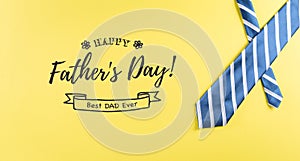 Happy Father`s Day background concept made from beautiful tie on pastel yellow background