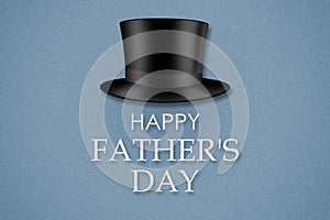 Happy father`s day background. Hat cylinder and the inscription on a gray background. Congratulatory background