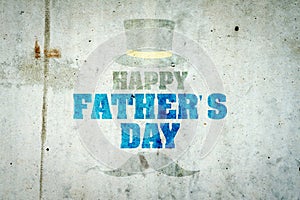 Happy father`s day background. Old shabby inscription on a concrete wall. Hat cylinder and mustache