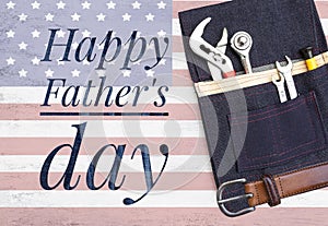 Happy Father\'s day banner with steel tools in design pocket tool bag on abstract USA flag background