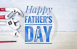 Happy Father\'s day banner with toosl on white wood background