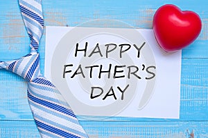 Happy Father`s Day with blue neckties and red heart shape on wooden background.  International Men`s Day concepts