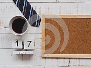 Happy father`s day concept. 17 June wooden block calendar, tie,