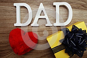 Happy Father`s Day concept with DAD alphabet letter with space copy on wooden background