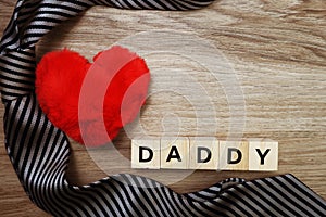 Happy Father`s Day concept with DADDY alphabet letter with space copy on wooden background