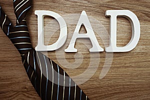 Happy Father`s Day concept with DADDY alphabet letter with space copy on wooden background