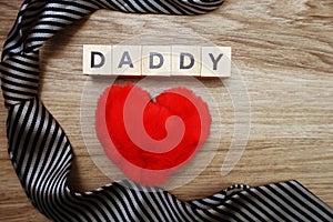 Happy Father`s Day concept with DADDY alphabet letter with space copy on wooden background