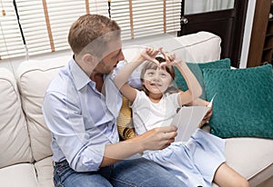 Happy Father`s day. Cute little girl making heart with hands for