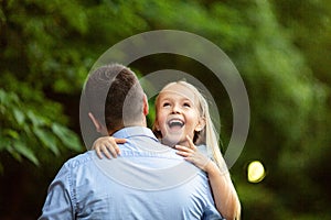 Happy father`s day. Dad and his child daughter are playing and having fun together. Family holidays