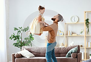 Happy father`s day! family dad and child daughter Princess dancing