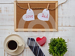 Happy Father`s Day inscription with colorful tie, redheart, plan