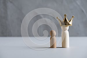 Happy Father`s Day with wooden people father, mother, children on a gray concrete wall background. Father in the crown. family