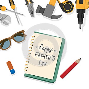 Happy Father`s Day word write by pencil on book page with top border of home tools isolated on white background