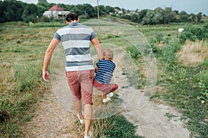 Happy father and son playing together