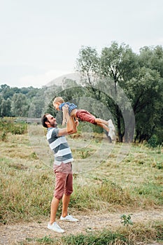 Happy father and son playing together