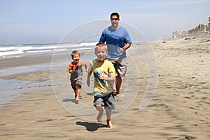 Happy Father & Sons on the Beach photo