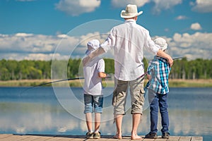 happy father with sons on a fishing trip