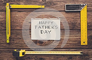 Happy Fathers Day background, card on rustic wood with repair tools