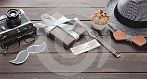 Happy Fathers Day card on rustic wood background