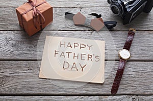 Happy Fathers Day card on rustic wood background