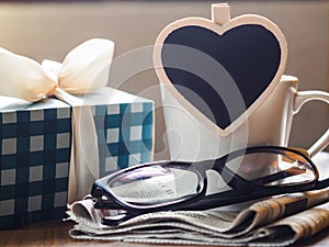 Happy fathers day concept. coffee cup with gift box, heart tag a