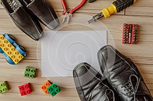 Happy fathers day, fathers shoes and baby boys shoes overhead, flat lay