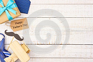 Happy Fathers Day gift tag with side border of gifts, ties and decor on white wood