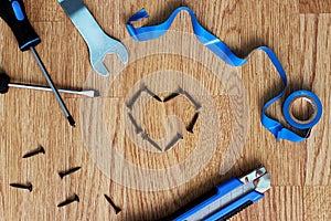 Happy Fathers Day with tools on a rustic wood background.